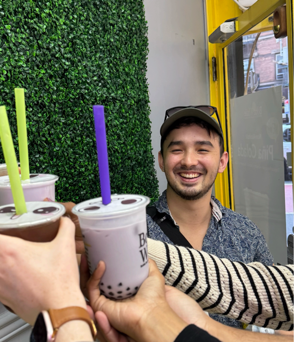 Nathan Lee cheers boba drinks with others