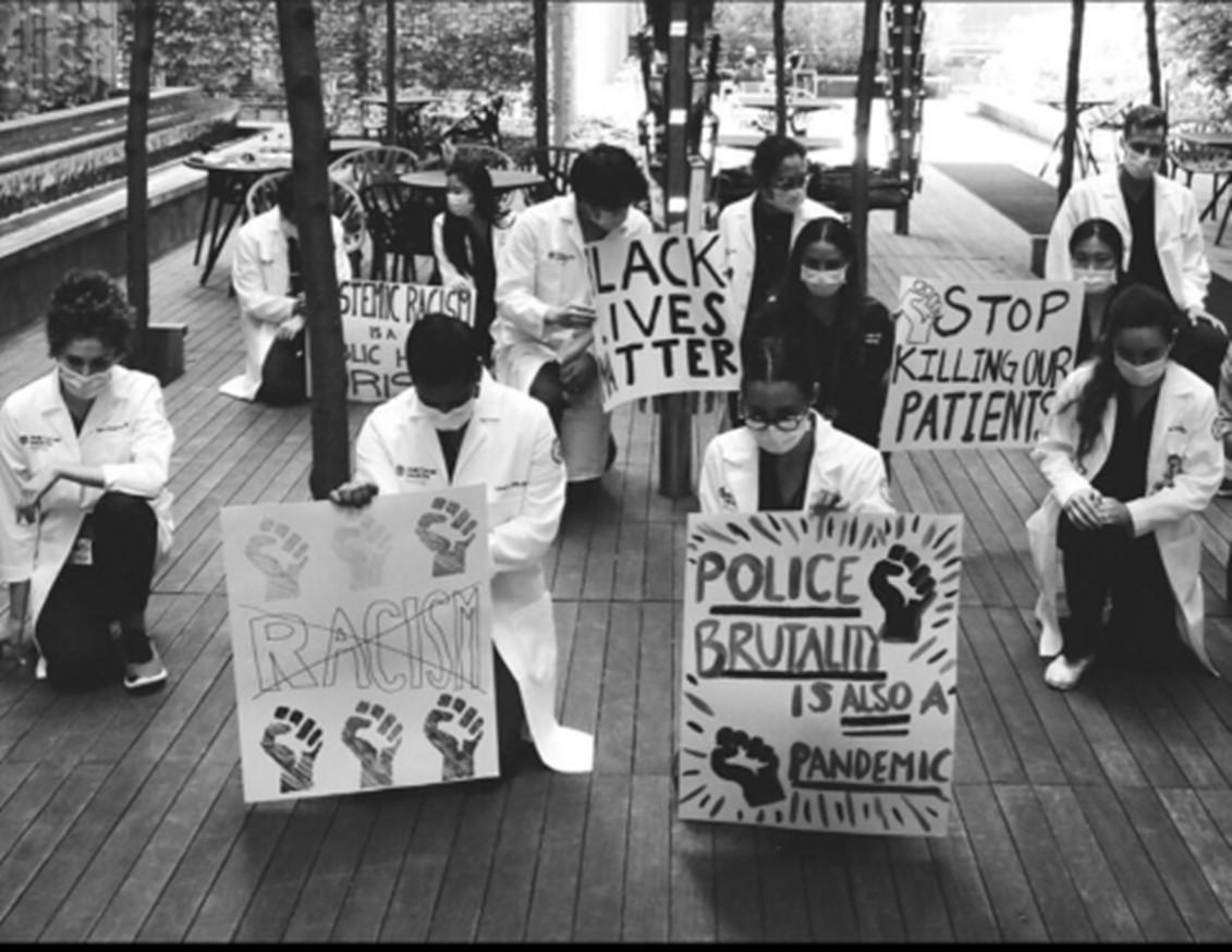 Resident Highlights Against Police Brutality Signs