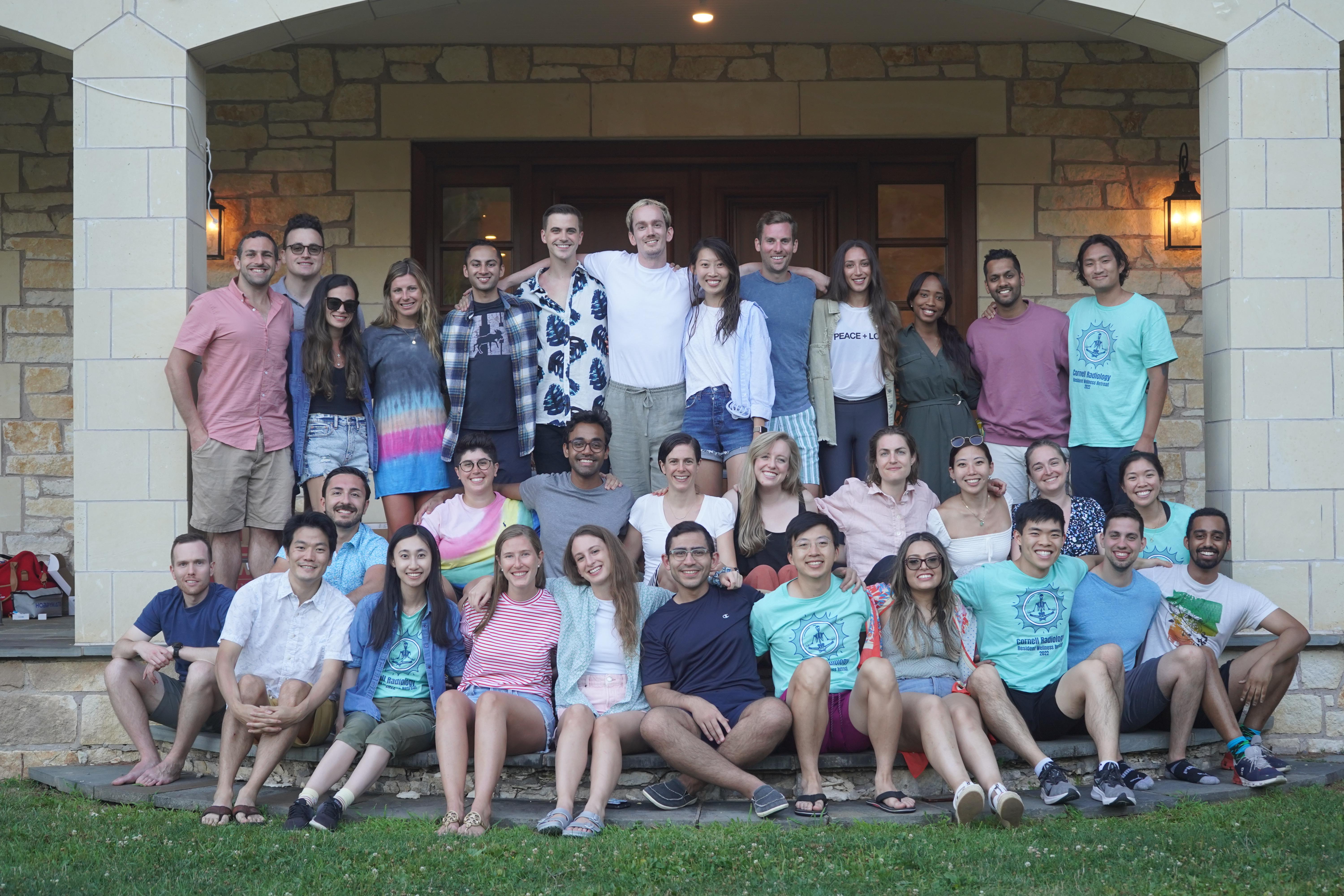 residents smile in a group photo at the wellness retreat